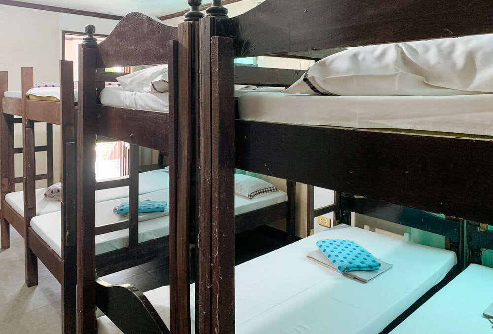 Single bed in mixed dormitory