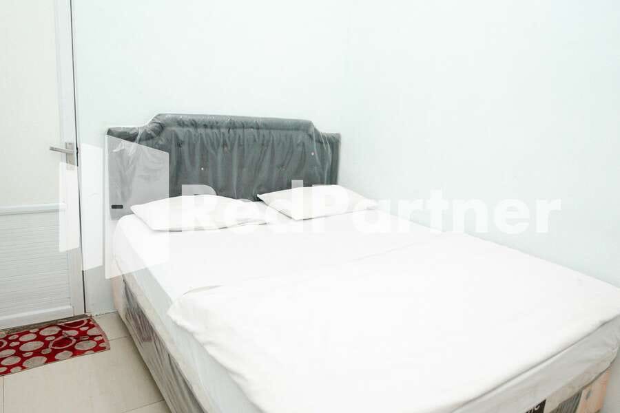 Happy Inn Puspo Mitra RedDoorz