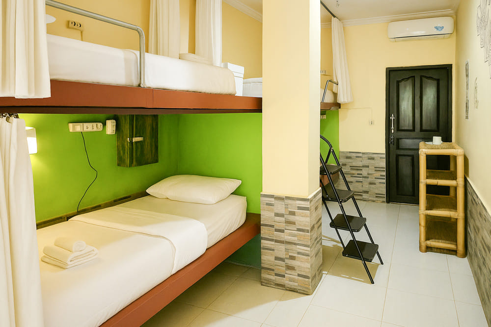 Single bed in mixed dormitory